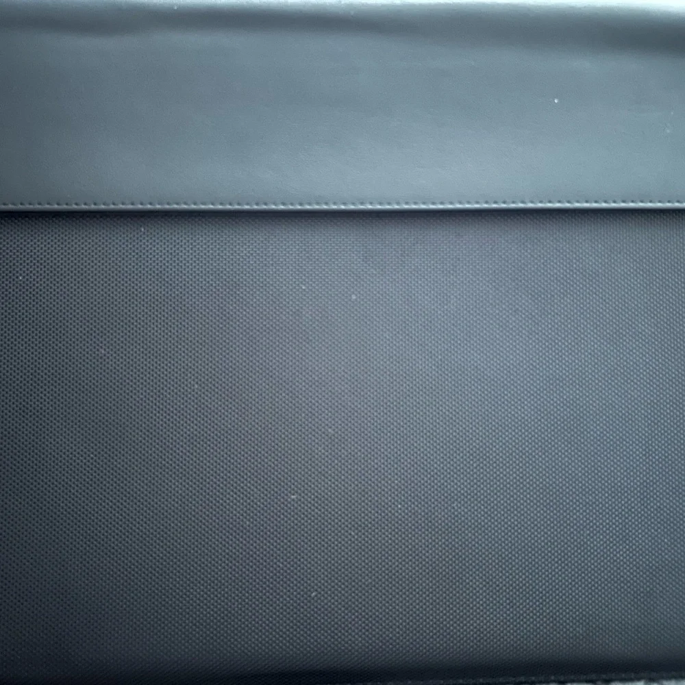 ASUS Laptop monitors Black Textured Laptop Cover with Silver Labels and cables.